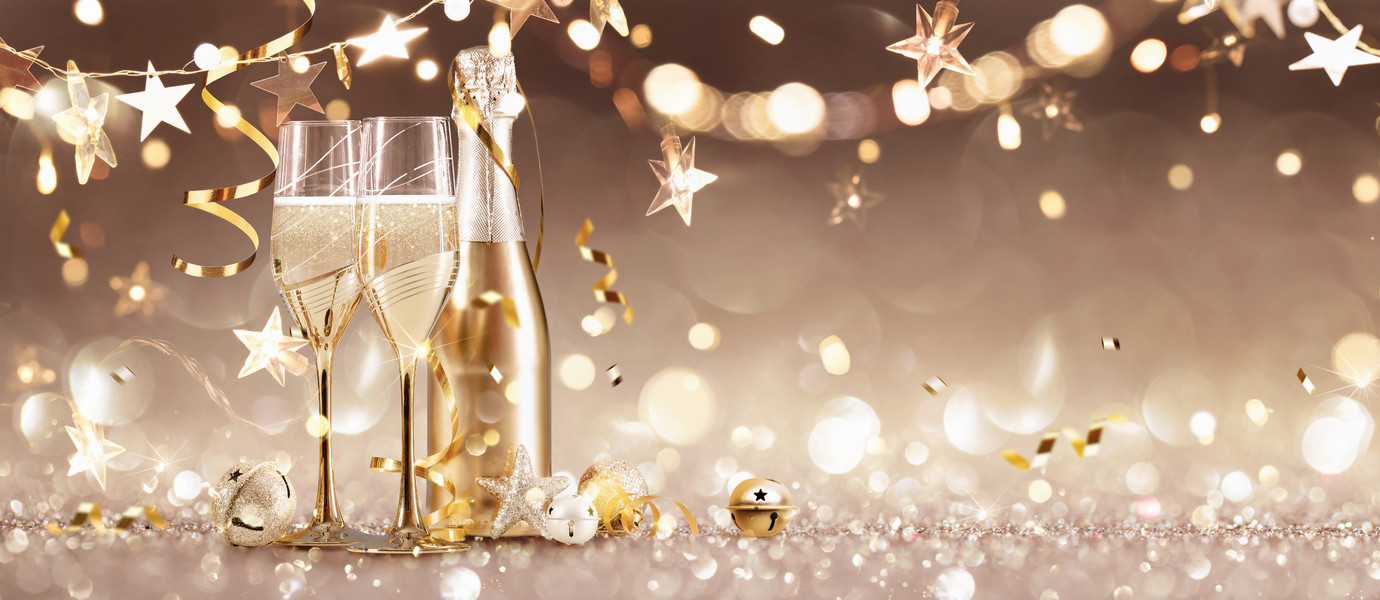 New Years Eve Celebration Background with Champagne and Confetti. Golden Holiday Party